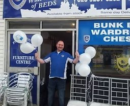 Owner outside the original Portsmouth Furniture Centre shop on Fawcett Road